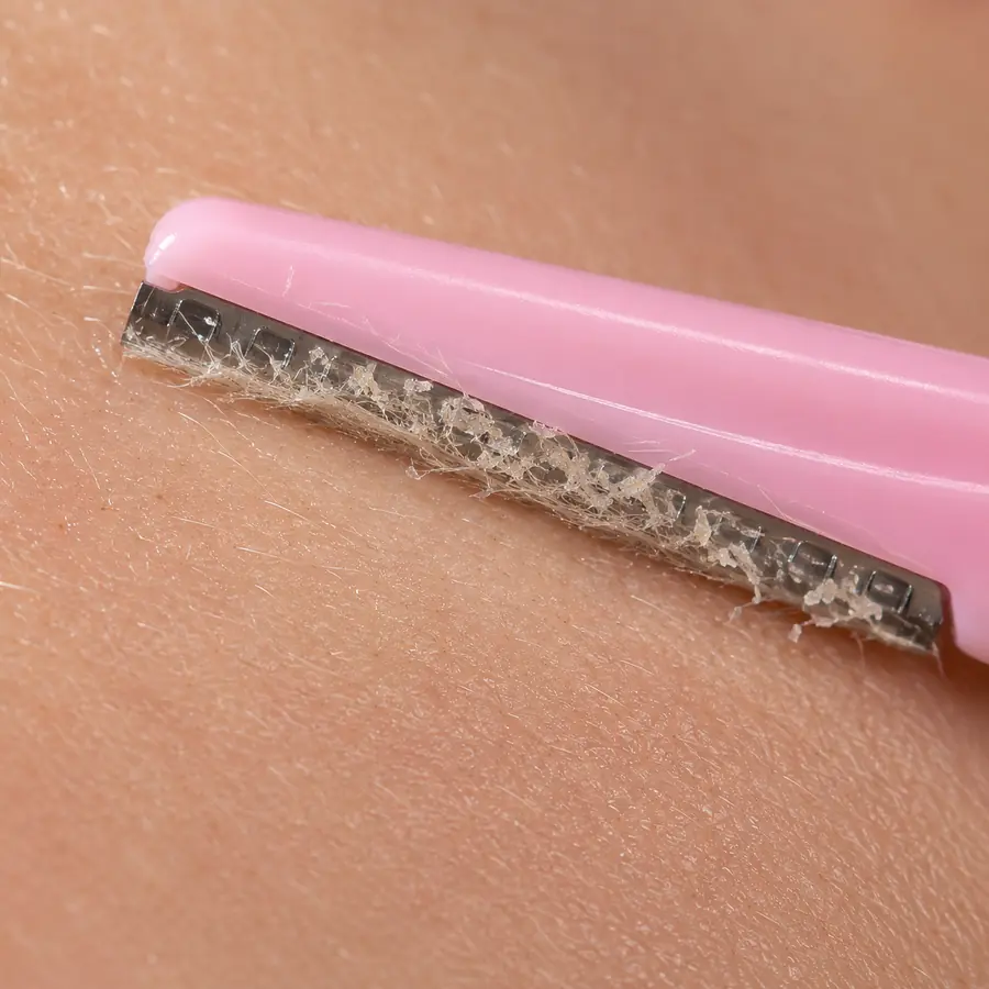 Fine hair and dead skin lifted onto the blade after one pass